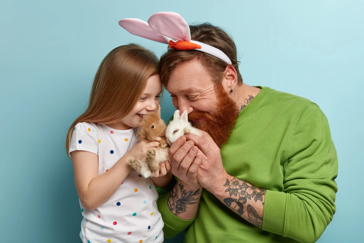 man with ginger beard wearing colorful clothes his daughter holding rabbit ezgif.com optiwebp